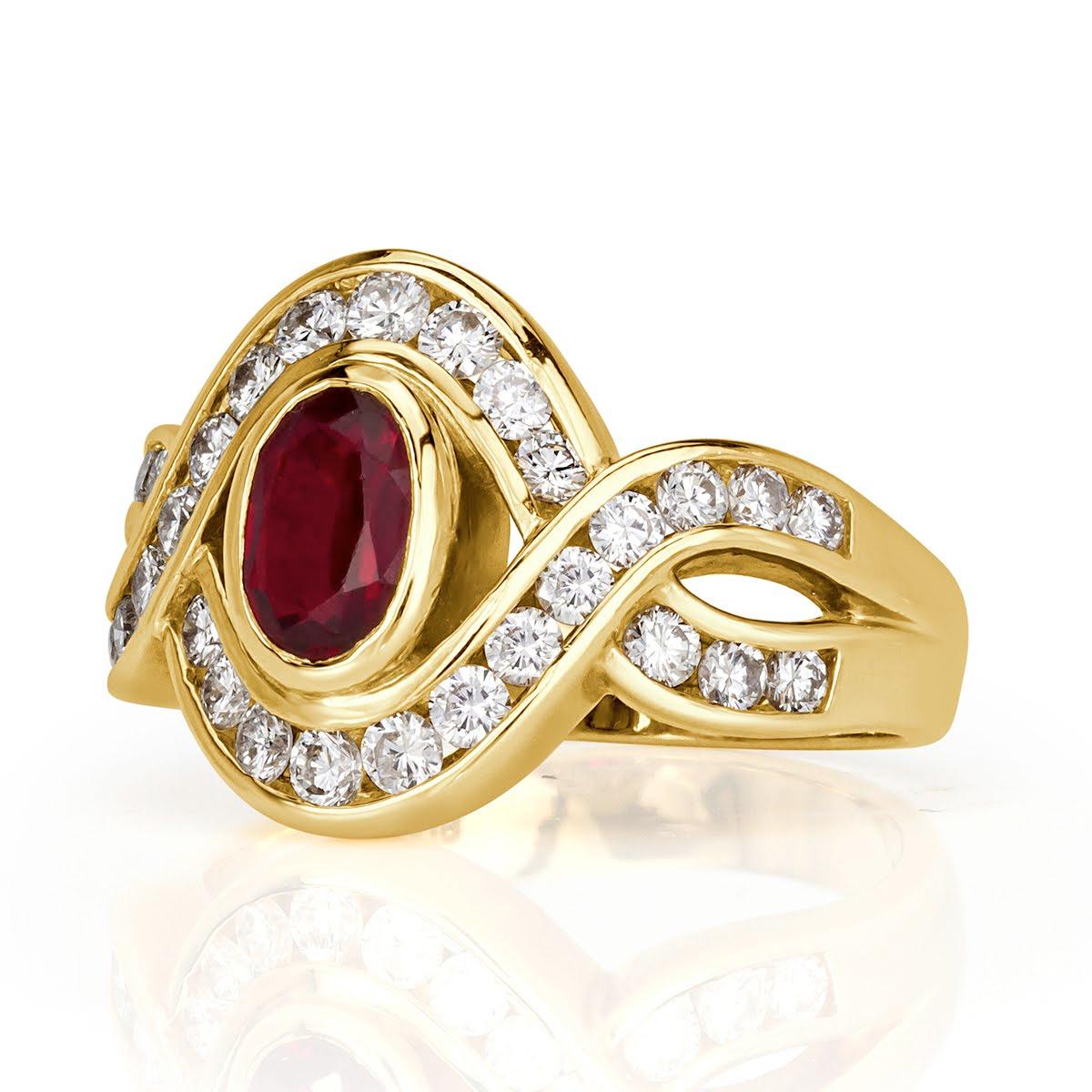 Created in 18k yellow gold, this ravishing vintage ring showcases a 0.94ct oval cut center ruby accented by 0.78ct of round brilliant cut diamonds set on the unique shank design. It sits lovely on the finger!
