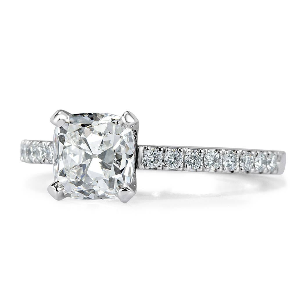 This lovely diamond engagement ring is set with a 1.51ct old Mine cut center diamond, GIA certified at F-SI2. It is accented by 0.25ct of round brilliant cut diamonds hand set on the delicate platinum shank.