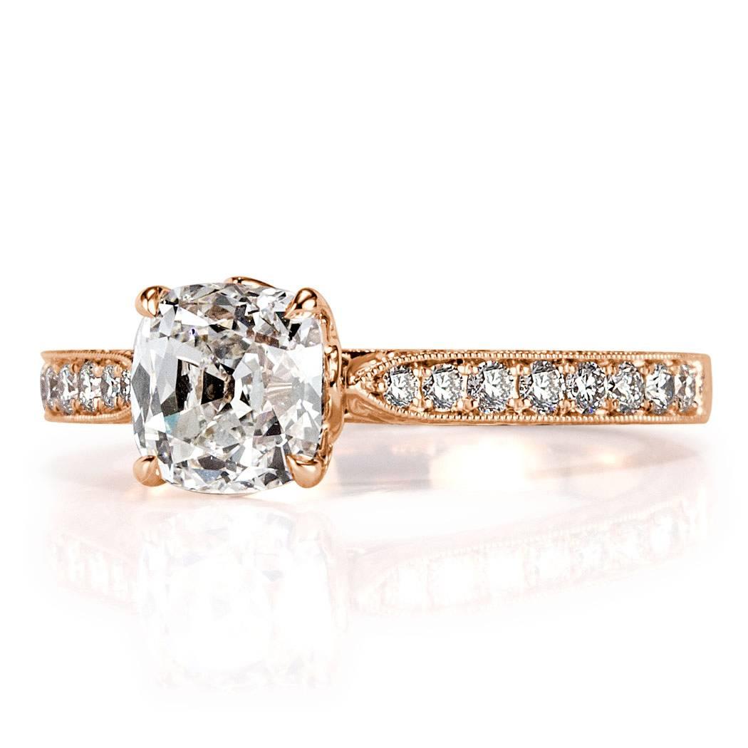 This ravishing diamond engagement ring is set with a gorgeous 1.50ct old Mine cut center diamond, GIA certified at I-VS1. It is elegantly showcased in a vintage, 18k rose gold setting style accented with 0.30ct of shimmering diamonds pavé set around