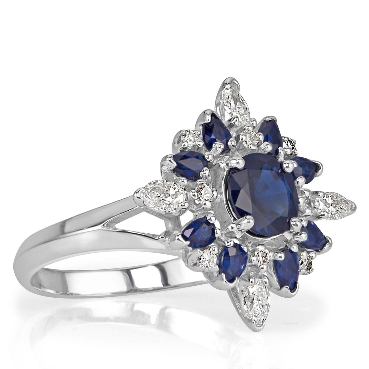 Created in 18k white gold, this stunning sapphire and diamond estate ring showcases a gorgeous 1.02ct round cut sapphire, GIA certified. It is accented by an additional 0.80ct of oval, round brilliant cut and pear shaped diamonds hand set in a