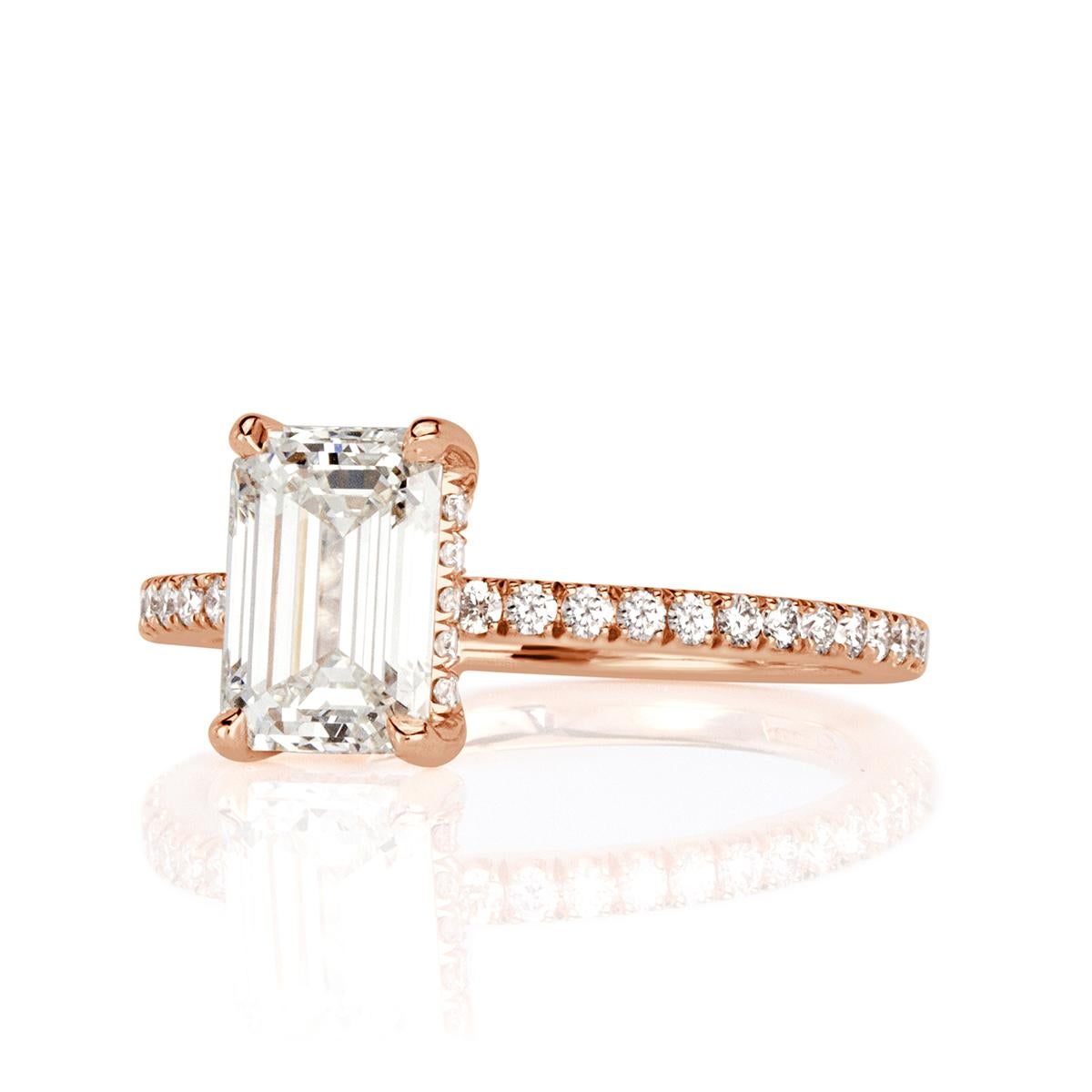 Custom created in 18k rose gold, this exquisite diamond engagement ring features a gorgeous 1.51ct emerald cut center diamond, GIA certified at I in color, VS1 in clarity. It has exceptional measurements of 8.04 x 5.54mm in addition of being graded
