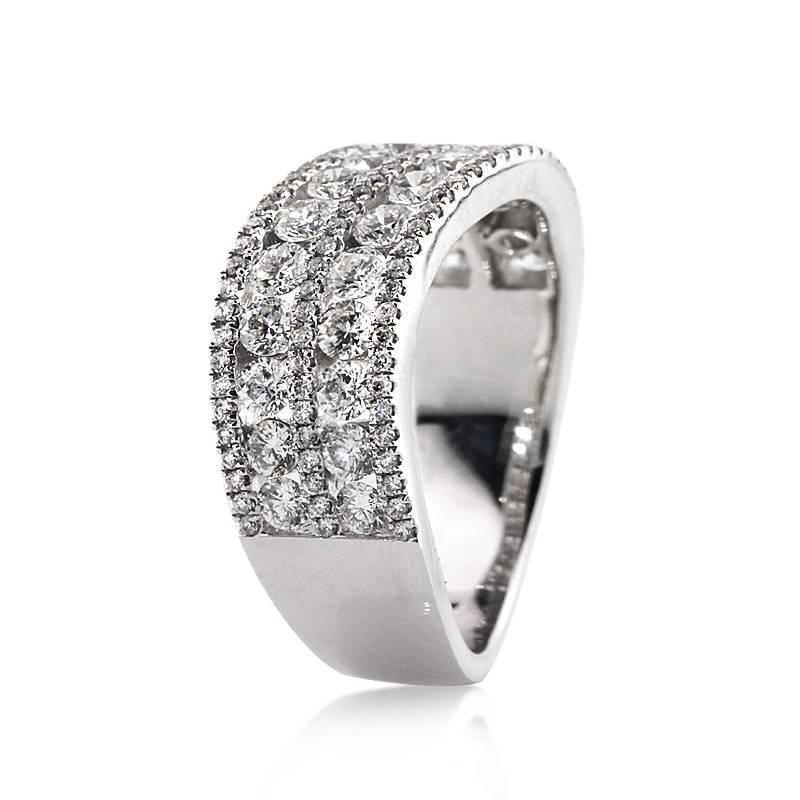 This stunning diamond ring is set with 1.85ct of round brilliant cut diamonds graded at E-F, VS1-VS2. It features two rows of larger diamonds channel set in between rows of smaller sparkling diamonds. The diamonds are matched and set in 14k white