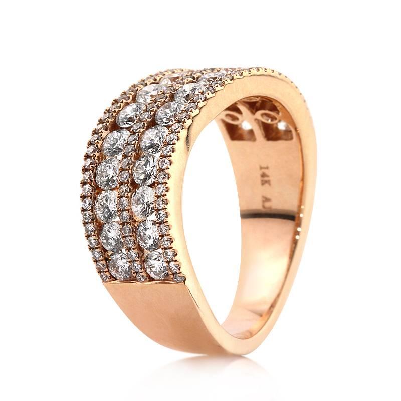 This stunning diamond ring is set with 1.85ct of round brilliant cut diamonds graded at E-F, VS1-VS2. It features two rows of larger diamonds channel set in between rows of shimmering diamonds. The diamonds are impeccably matched and set in 14k rose