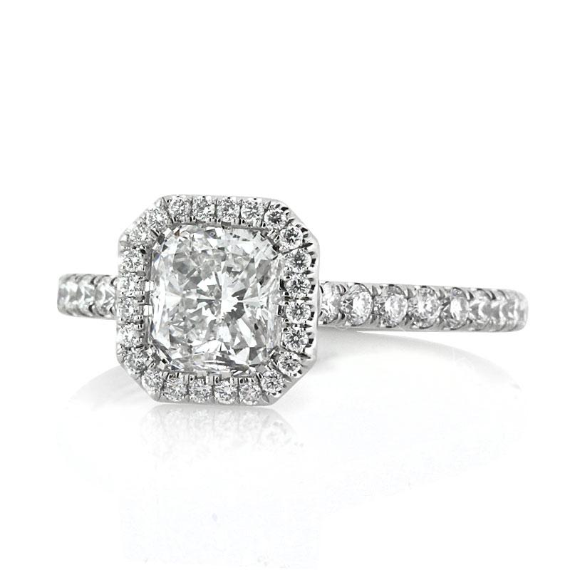 This truly ravishing diamond engagement ring features a 1.11ct radiant cut center diamond, EGL certified at D-SI1. It is accented by a matching micro pavé halo as well as one row of round brilliant cut diamonds micro pavé set past half way around