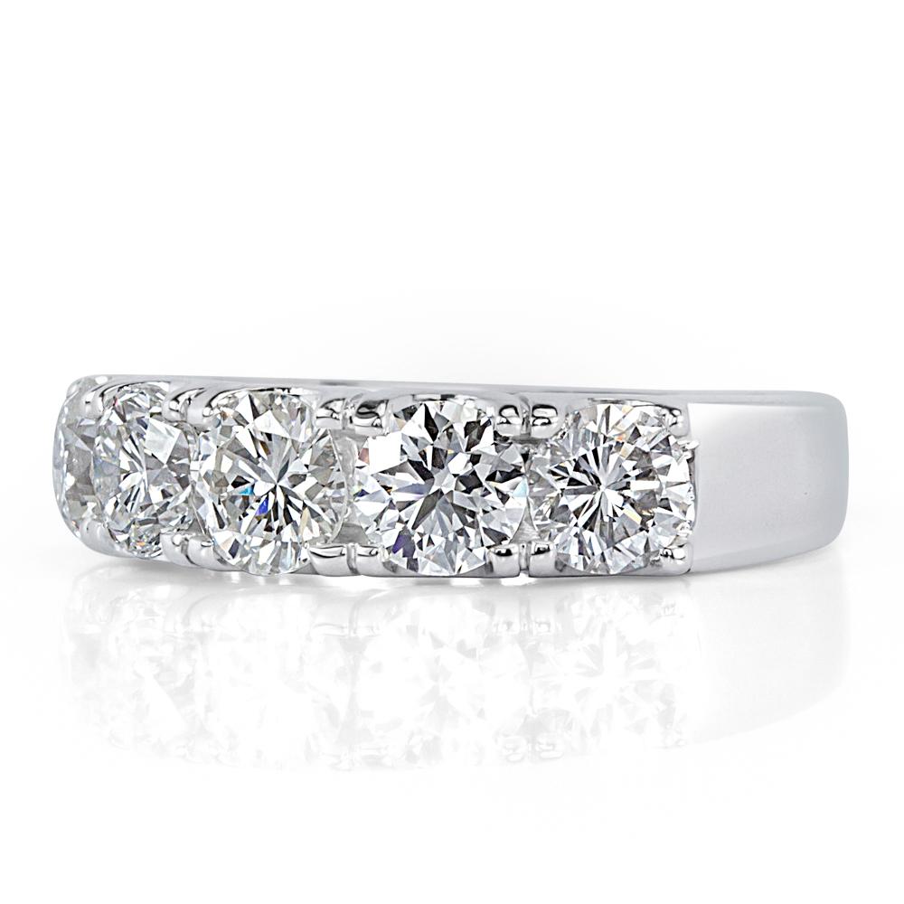 Handcrafted in high polish white gold, this beautiful and versatile diamond ring showcases 1.90ct of intensely bright round brilliant cut diamonds graded at F-G in color, VS1-VS2 in clarity.
