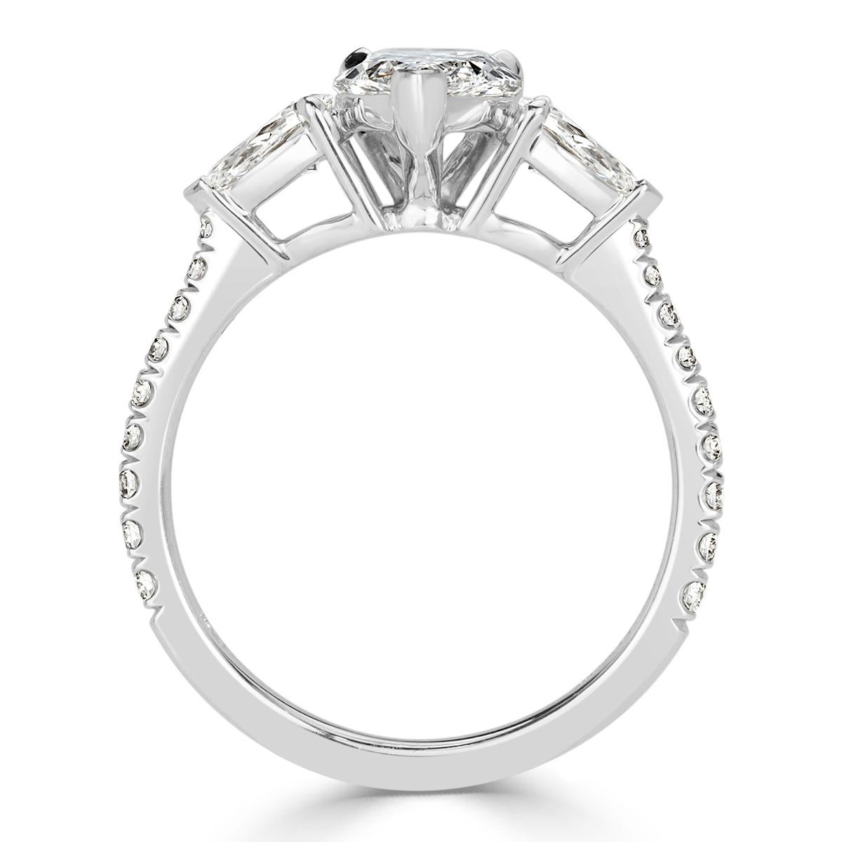 This delightful diamond engagement ring showcases a stunning 1.21ct pear shaped center diamond, GIA certified at D in color, VVS1 in clarity.It is exceptionally white and clear with amazing measurements of 10.64 x 6.37 mm which allows this gem to