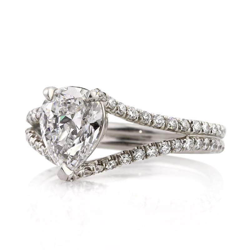 This stunning diamond engagement ring features a superb 1.33ct pear shaped center diamond, GIA certified at D-VVS2. The color and clarity are exceptional! It is beautifully showcased atop an exquisite platinum split shank micro pavé set with 0.65ct