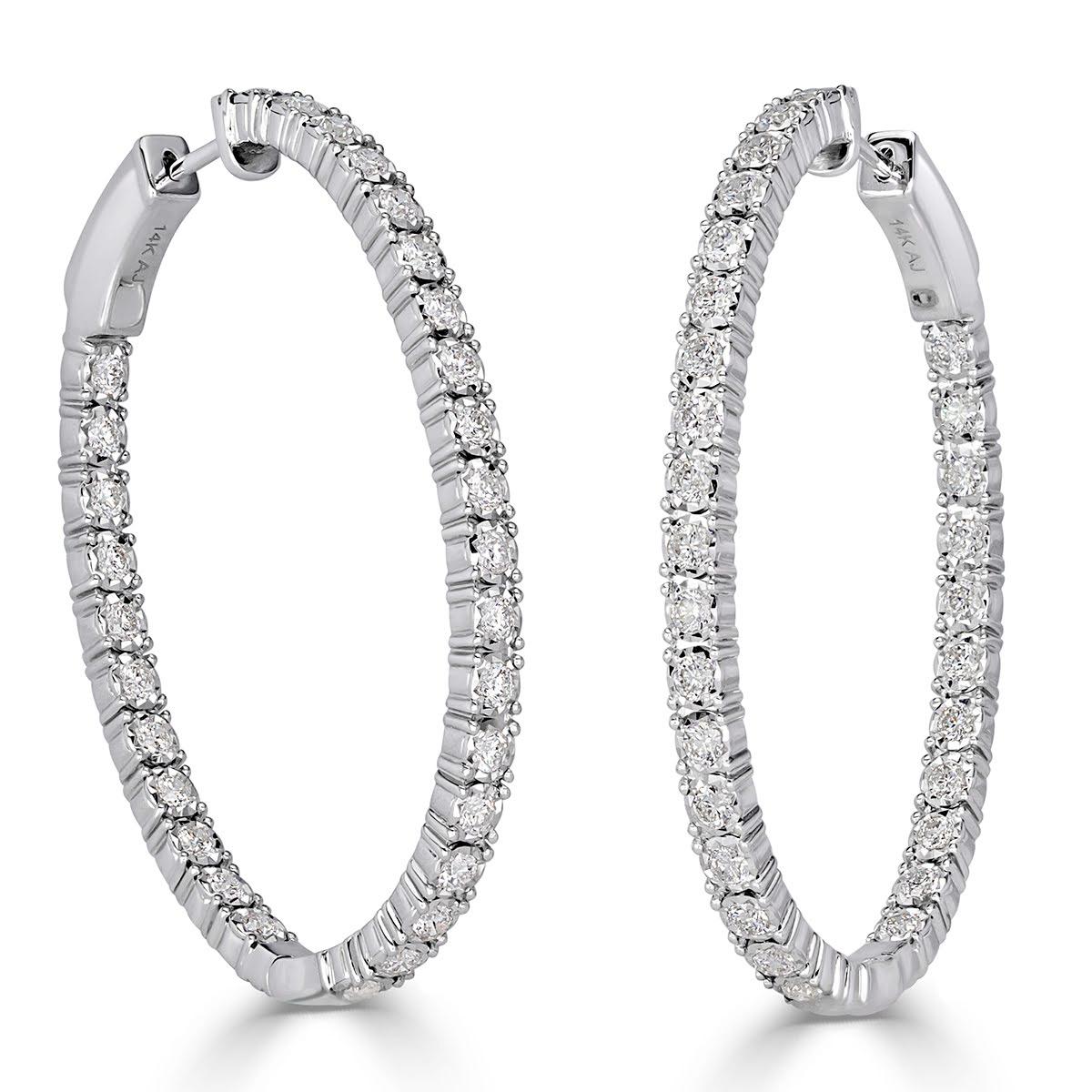 This stylish pair of diamond hoop earrings showcases 1.98ct of round brilliant cut diamonds set in 14k white gold. The diamonds are graded at E-F in color, VS2-SI1 in clarity. For extra sparkle, the diamonds are set on the outside as well as on the
