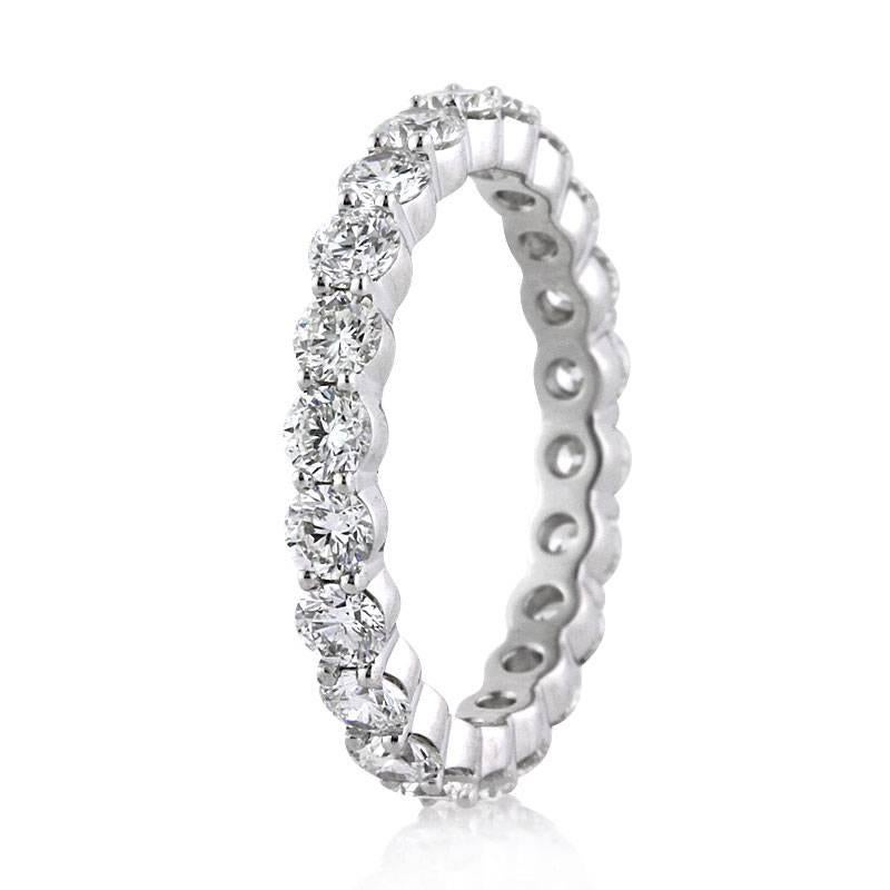 This beautiful diamond eternity band showcases 2.00ct of round brilliant cut diamonds graded at F-G, VS1-VS2. They are impeccably matched and hand set in 18k white gold. All eternity bands are shown in a size 6.5. We custom craft each eternity band