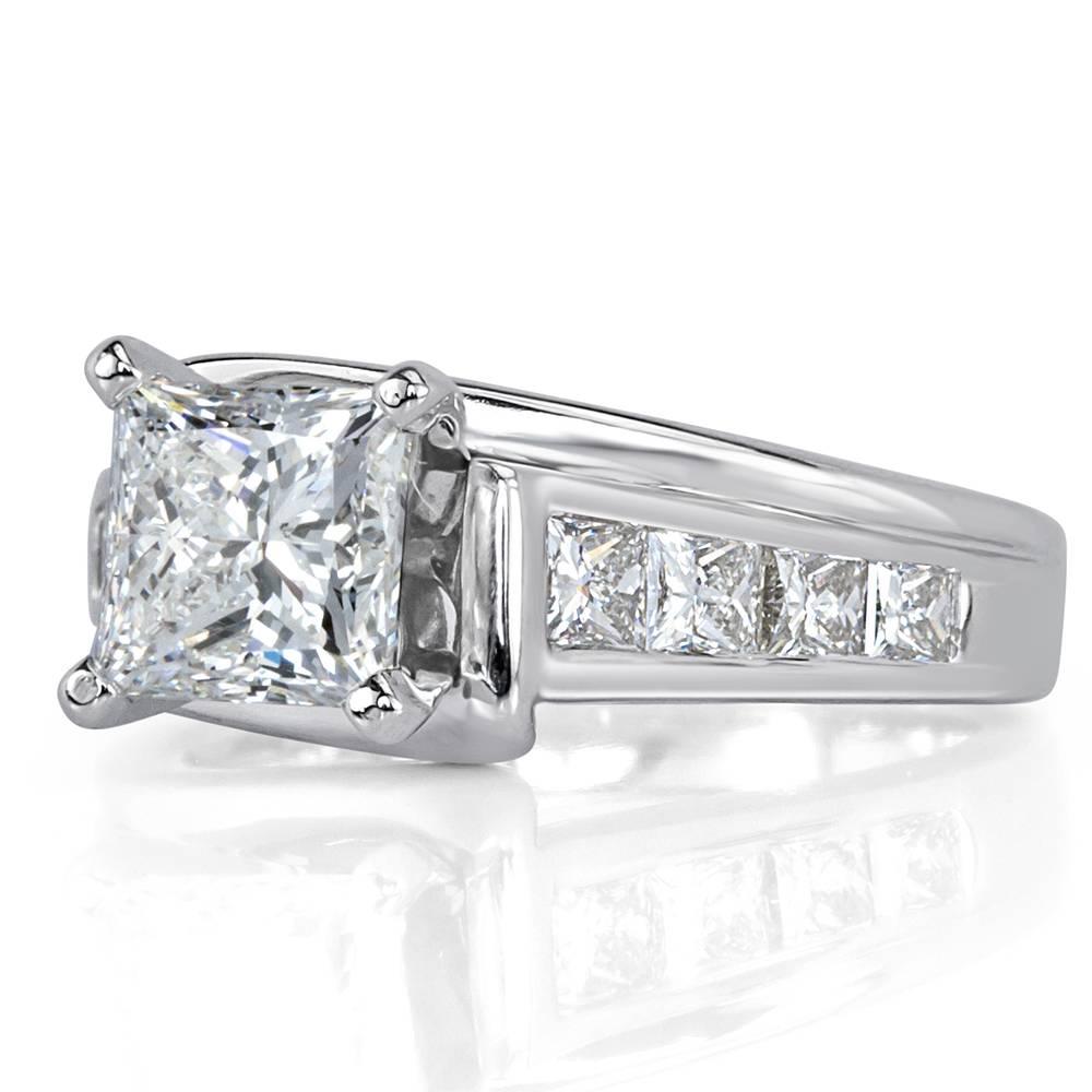 This gorgeous diamond engagement ring showcases a 1.51ct princess cut center diamond GIA certified at F, SI1. It is accented by 0.50ct of princess cut diamonds channel set to perfection in the 14k white gold shank. All of the side diamonds are