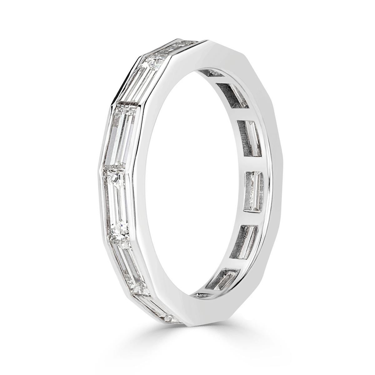 Custom designed in high polish platinum, this chic diamond eternity band showcases 2.05ct of baguette cut diamonds graded at E-F in color, VVS2-VS1 in clarity. All eternity bands are shown in a size 6.5. We custom craft each eternity band and will