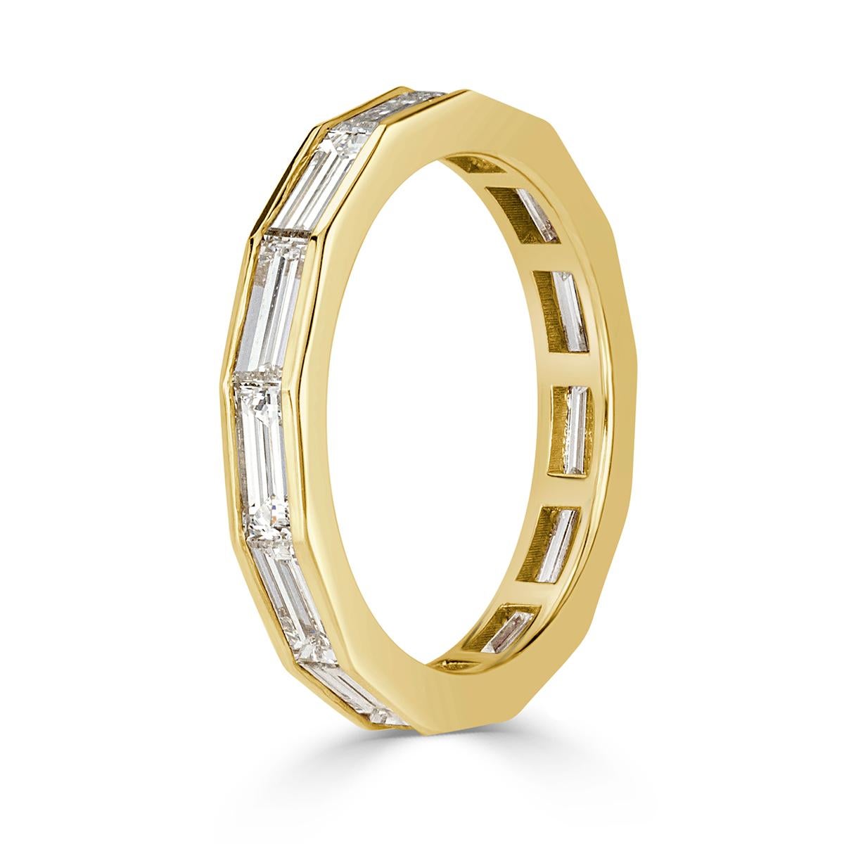 Designed in 18k yellow gold, this exquisite diamond eternity band showcases 2.05ct of baguette cut diamonds graded at E-F in color, VVS2-VS1 in clarity. All eternity bands are shown in a size 6.5. We custom craft each eternity band and will create