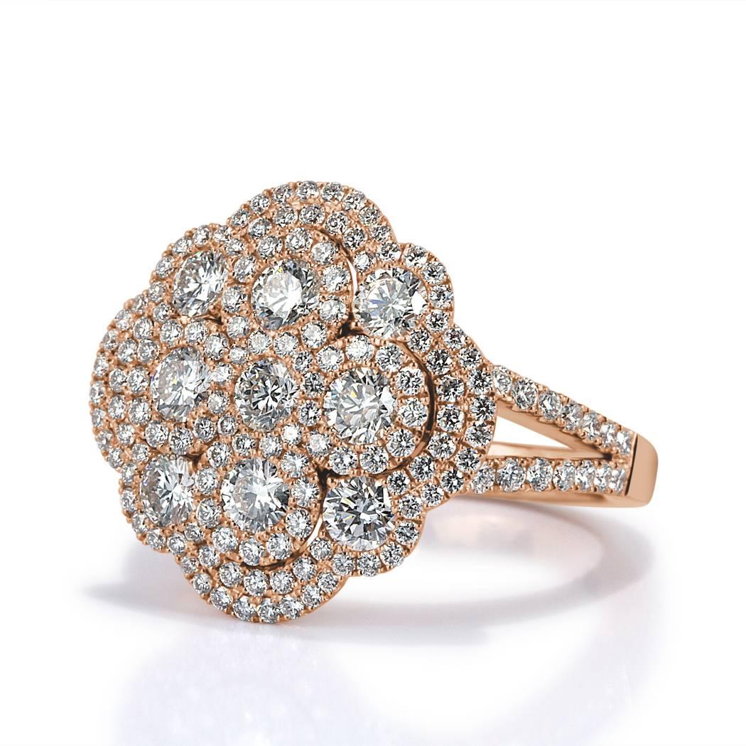 This exquisite diamond cluster ring features 2.10ct of round brilliant cut diamonds graded at E-F in color, VS1-VS2 in clarity. They are beautifully matched and set in 18k rose gold.