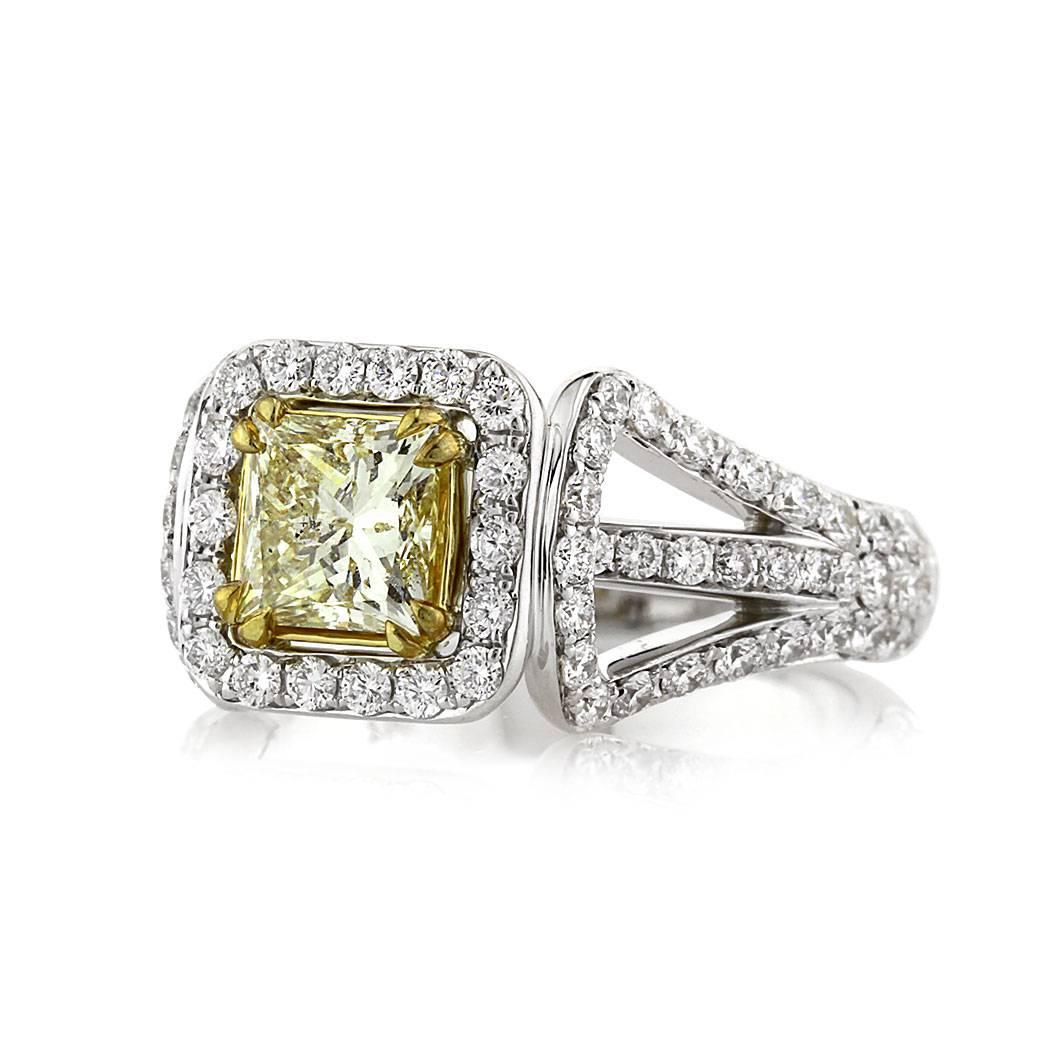 This gorgeous princess cut diamond engagement ring features a beautiful 0.97ct princess cut center diamond, EGL certified at Fancy Light Yellow-SI2. It is accented by a halo of peerless white round brilliant cut diamonds and poised atop a unique