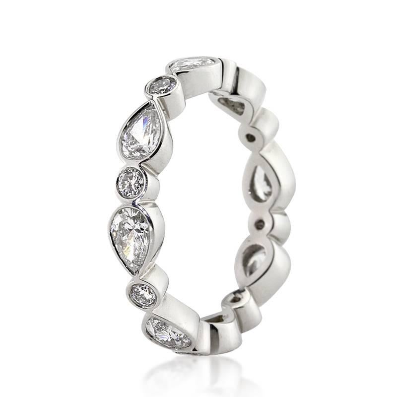 This lovely diamond eternity band features 2.20ct of pear shaped and round brilliant cut diamonds graded at F-G, VS1-VS2. All of the diamonds are exquisitely matched and bezel set to perfection in 18k white gold. All eternity bands are shown in a
