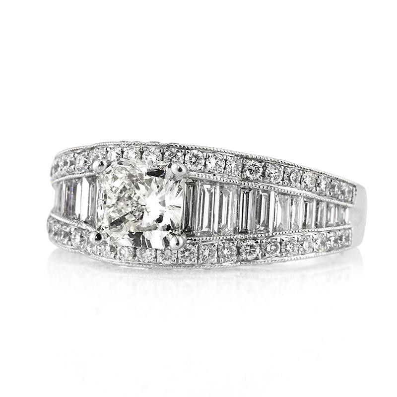 This stunning diamond engagement ring showcases a gorgeous 1.00ct radiant cut center diamond, EGL certified at I in color, SI1 in clarity. It is accented by one row of juxtaposed baguette cut diamonds channel set in between two rows of round