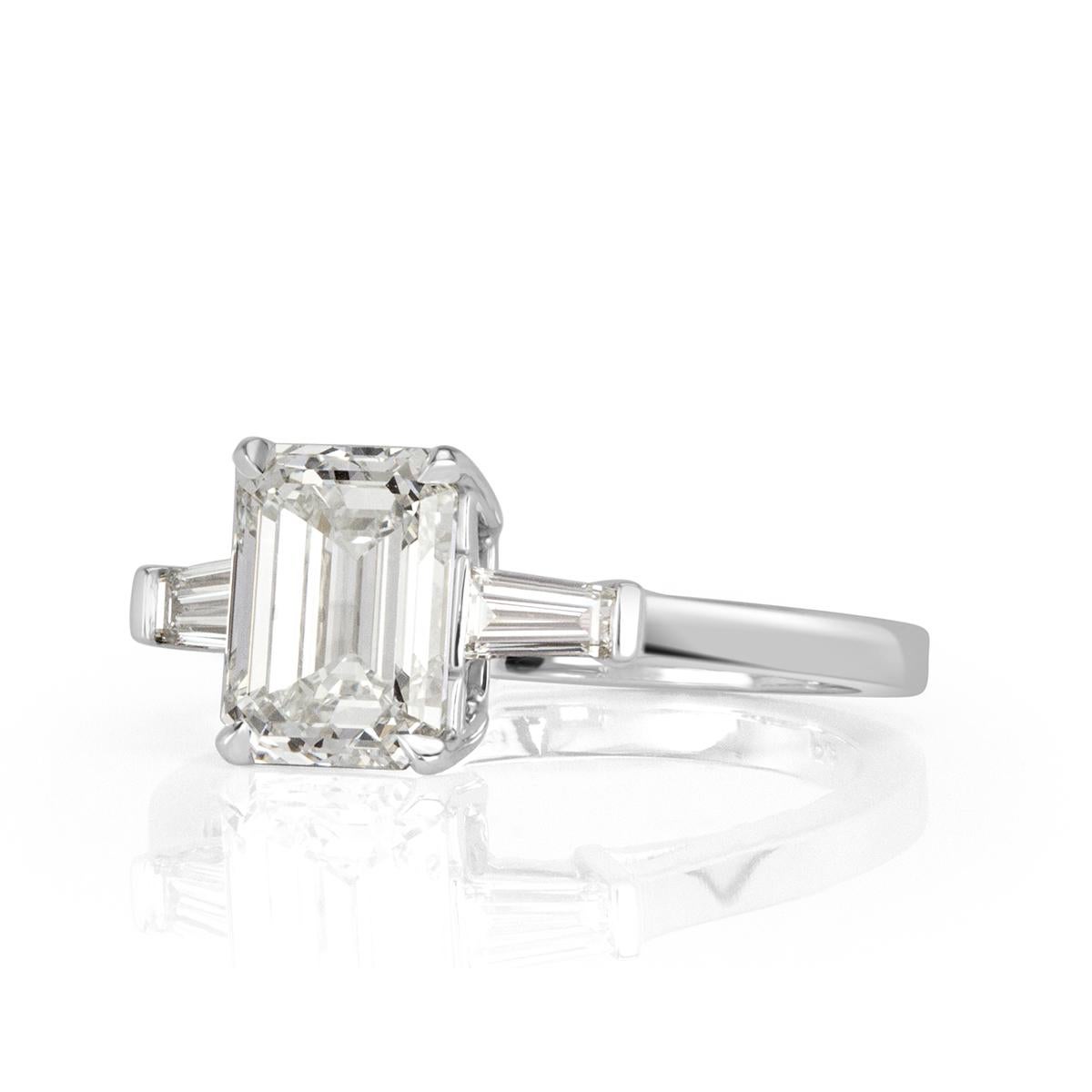 This stunning piece showcases a one of a kind 2.01ct emerald cut center diamond, GIA certified at I-VVS2. It faces up white and the clarity is outstanding! It measures an exceptional 8.25 x 6.13mm and is hand set in high polish platinum. It is