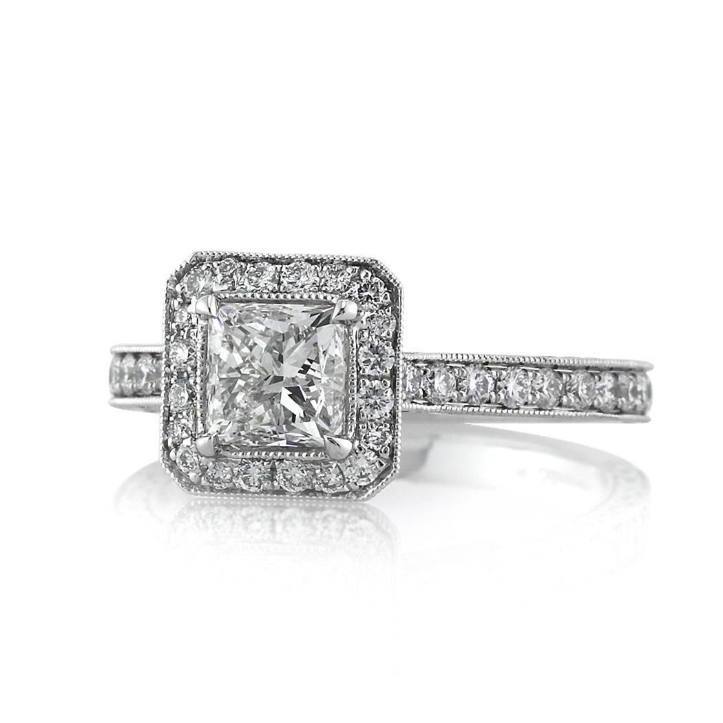 This ravishing diamond engagement ring features a lovely 1.01ct princess cut center diamond, EGL certified at F-VS1. It is accented by a two-sided halo of round brilliant cut diamonds and for maximum sparkle, the three-sided shank is also crafted in