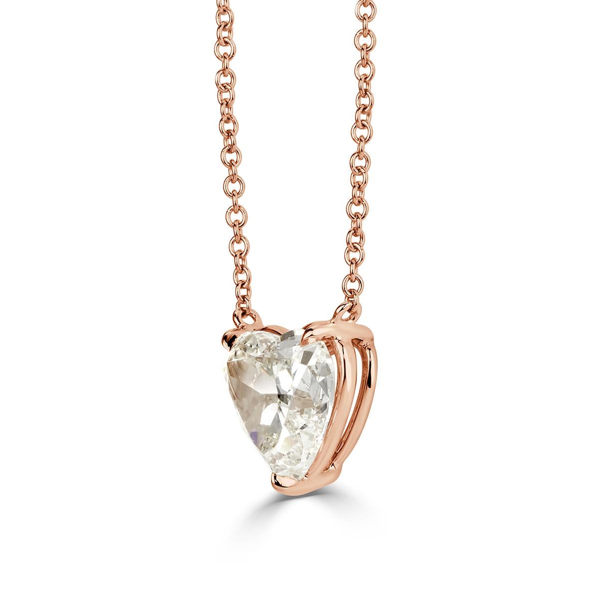 This exquisite diamond pendant showcases a beautiful heart shaped center diamond GIA certified at K-SI2. It radiates intense brilliance in our custom 18k rose gold setting and falls beautifully on the neckline.