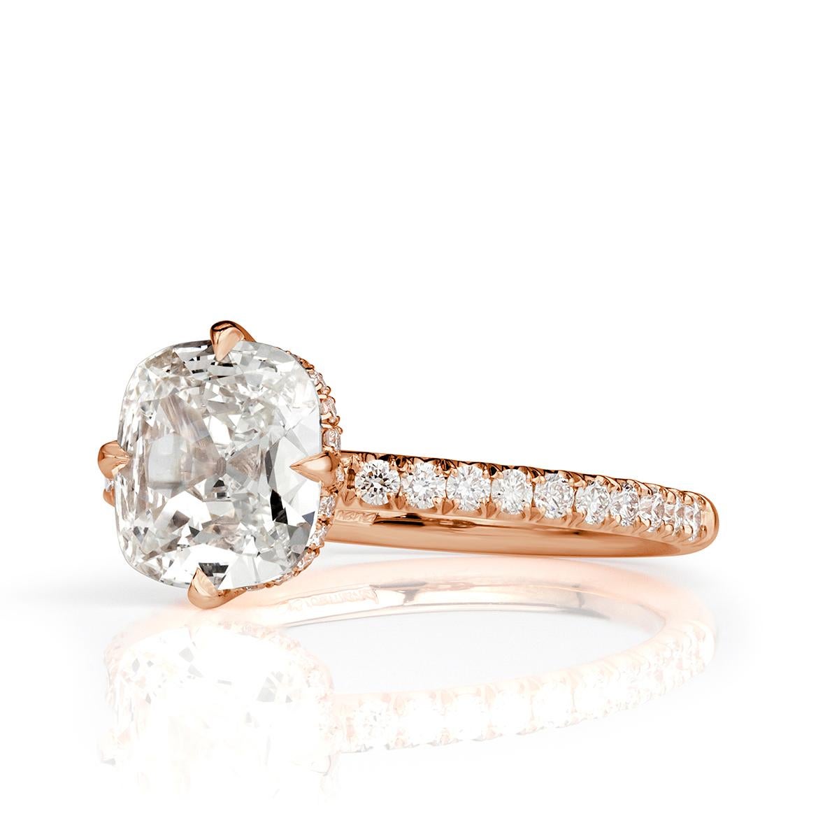 This stunning diamond engagement ring showcases a gorgeous 2.08ct old mine cut center diamond, GIA certified at I in color, SI2 in clarity. It is showcased to perfection in our custom 18k rose gold north-south-east-west setting style. It is accented