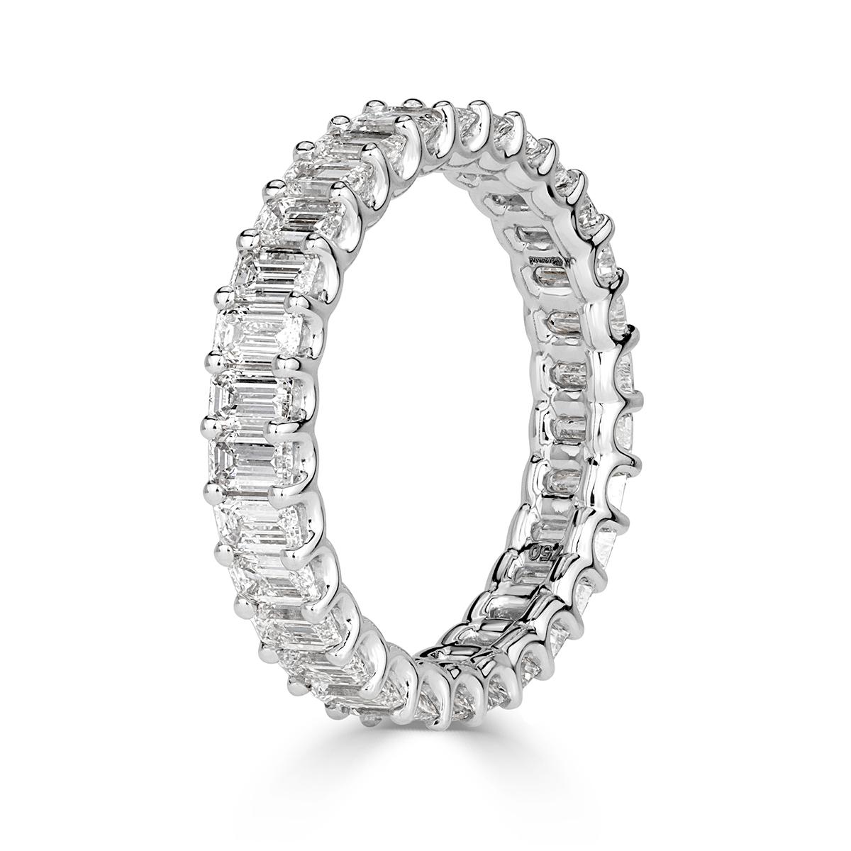 Created in 18k white gold, this ravishing diamond eternity band showcases 2.66ct of emerald cutdiamonds graded at E-F, VVS2-VS1. They are each hand selected and set in a 