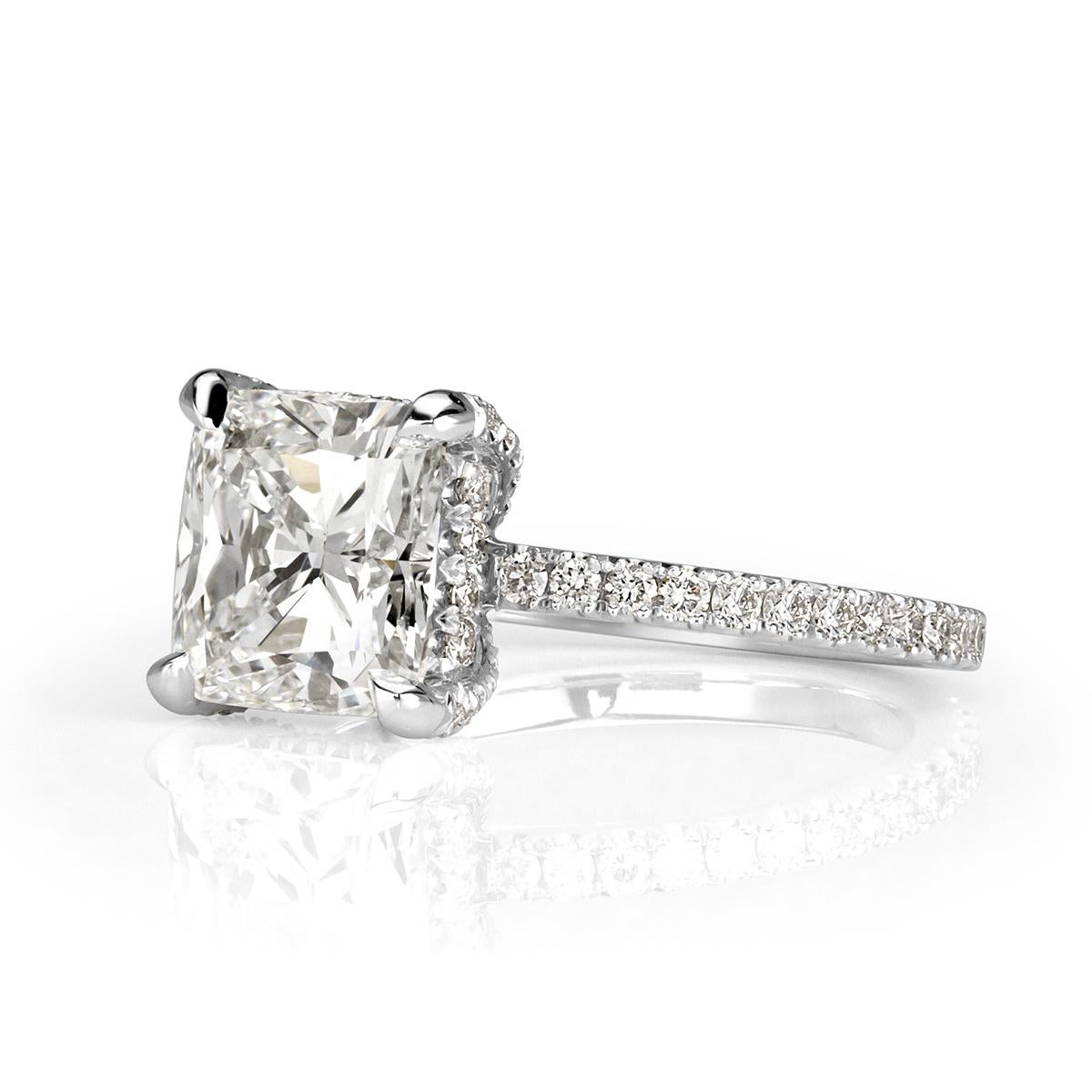 This stunning piece features a one of a kind 2.24ct cushion cut center diamond, GIA certified at H-VVS1. It has amazing measurements of 7.80 x 7.40mm and faces up a crisp white in addition of being graded at excellent in polish and symmetry. It is