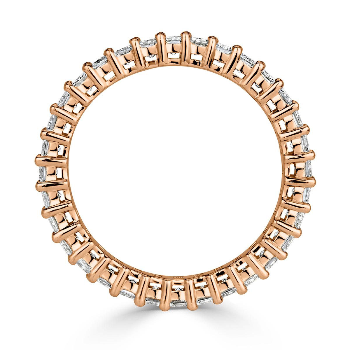 Created in 18k rose gold, this ravishing diamond eternity band showcases 2.70ct of emerald cut diamonds graded at E-F, VVS2-VS1 in clarity. They are set in a 
