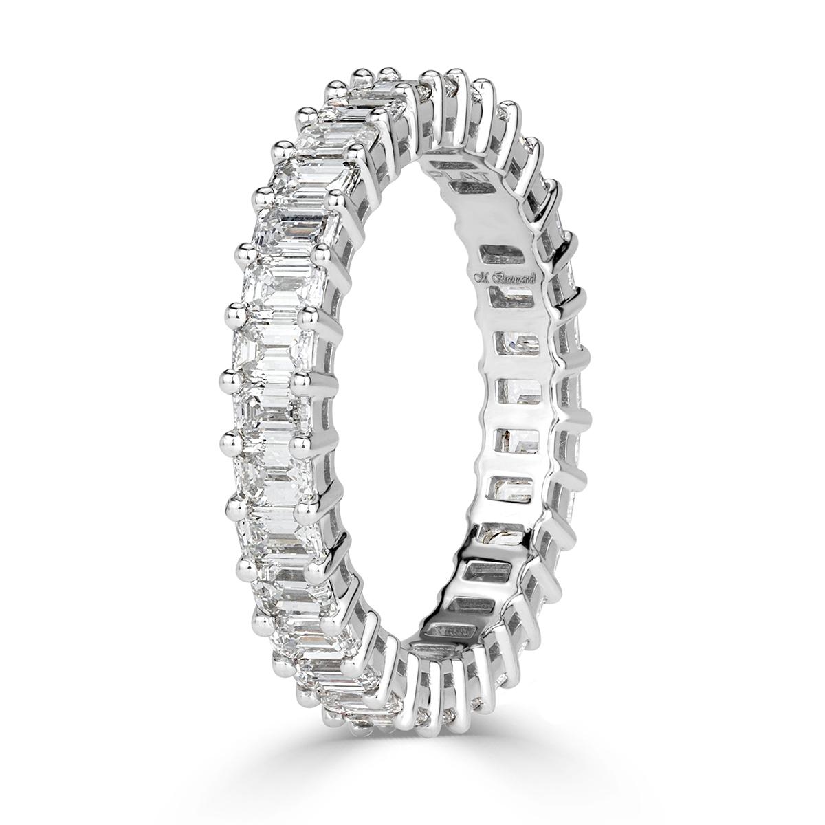 Created in 18k white gold, this ravishing diamond eternity band showcases 2.70ct of emerald cut diamonds graded at E-F, VVS2-VS1. They are seamlessly matched and set in a classic basket setting style. All eternity bands are shown in a size 6.5. We