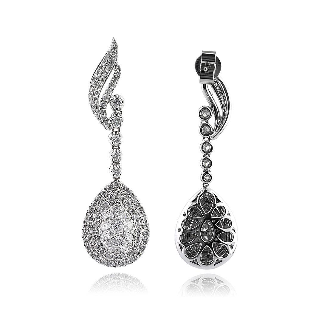 This gorgeous pair of diamond drop earrings showcases a stunning pear shaped design studded with round brilliant cut diamonds. The diamonds total 2.70ct in weight and are graded at F-G, VS2-SI1. For added sparkle, the very unique design at the top