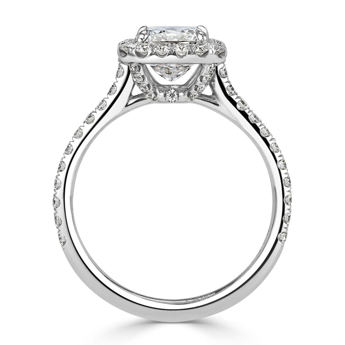 This one of a kind diamond engagement ring showcases a 2.02ct radiant cut center diamond, GIA certified at E-SI1. It is complimented to perfection by a dazzling halo of round brilliant cut diamonds and one row of shimmering diamonds micro pavé set