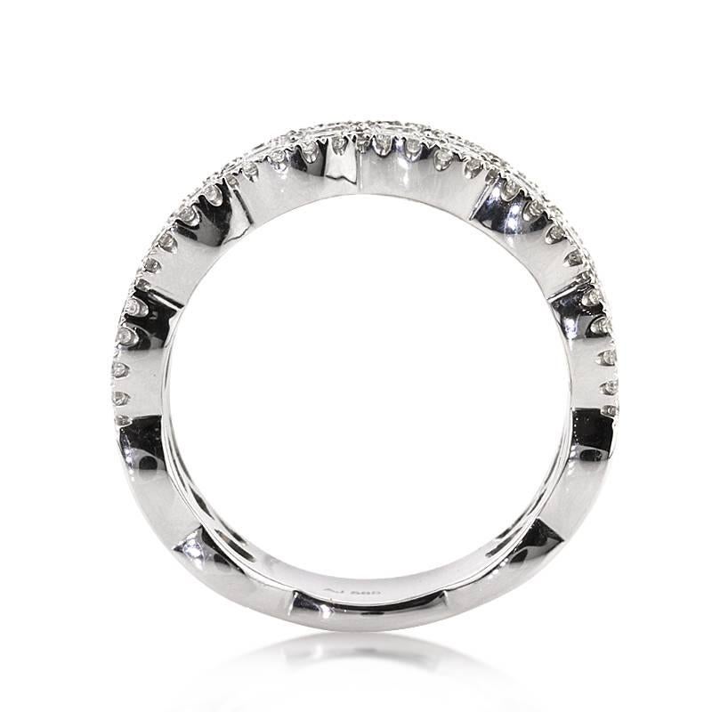This elegant diamond ring features 2.90ct of round brilliant cut diamonds graded at E-F, VS1-VS2. It showcases two rows of larger round brilliant cut diamonds accented by smaller diamonds both in between and on each side of the band. The diamonds