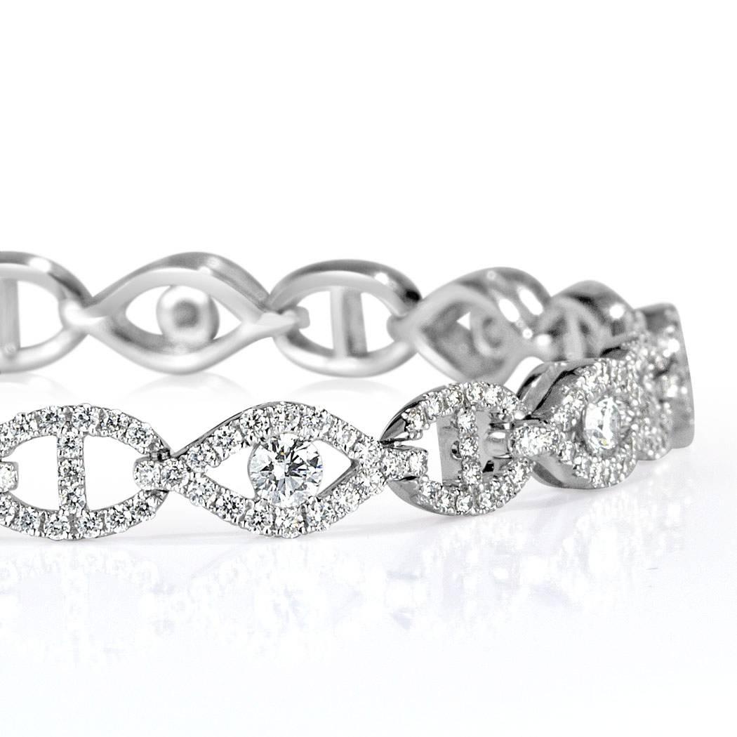 This lovely diamond link bracelet is set with 2.95ct of round brilliant cut diamonds graded at E-F, VS1-VS2. They are perfectly matched and micro pavé set in 14k white gold.