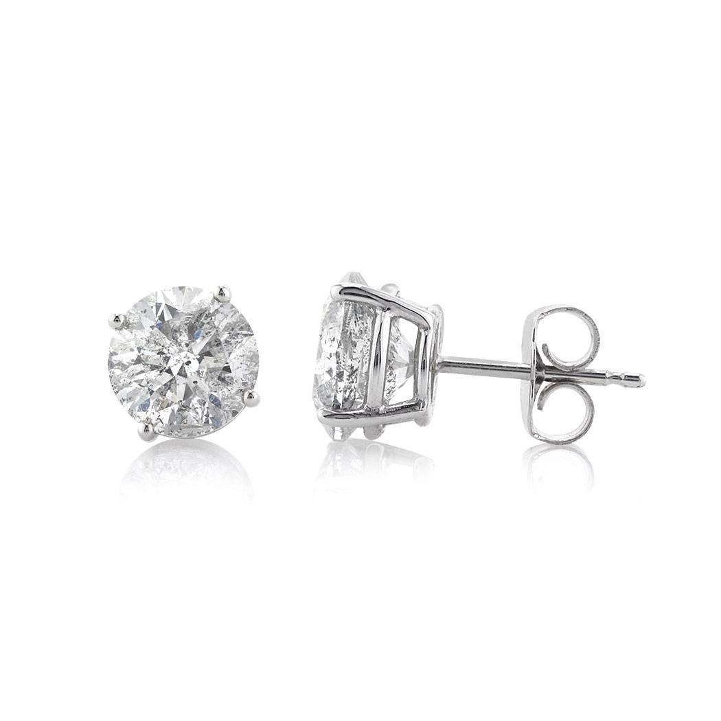This gorgeous pair of diamond stud earrings features two stunning round brilliant cut diamonds with a total weight of 3.54ct and EGL certified at F-I1, G-I2. They are set in a classic four-prong,  14k white gold setting with butterfly backs.