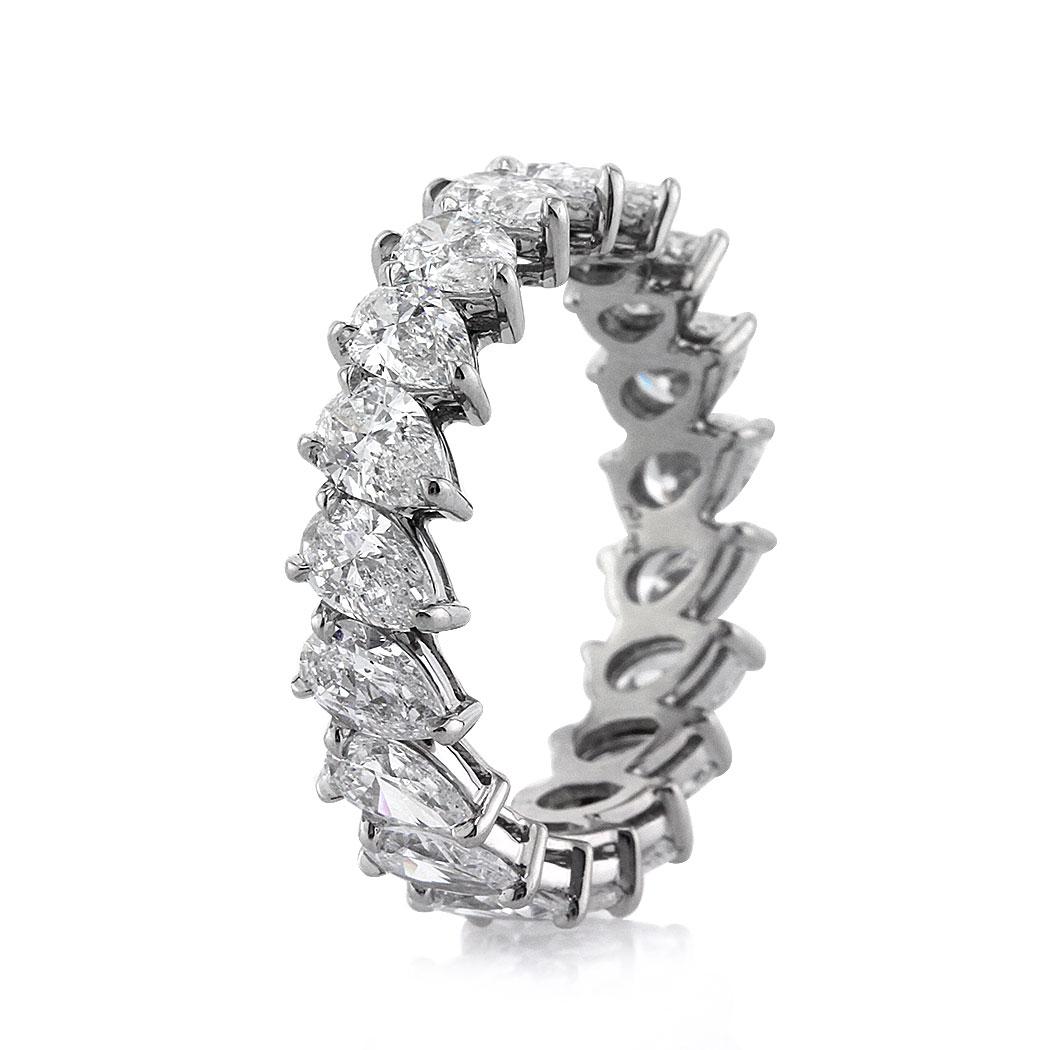 Handcrafted in 18k white gold, this absolutely stunning diamond eternity band showcases 3.65ct of peerless white pear shaped diamond graded at E-F in color, VS1-VS2 in clarity. They are set sideways in a custom setting with hardly any metal showing.