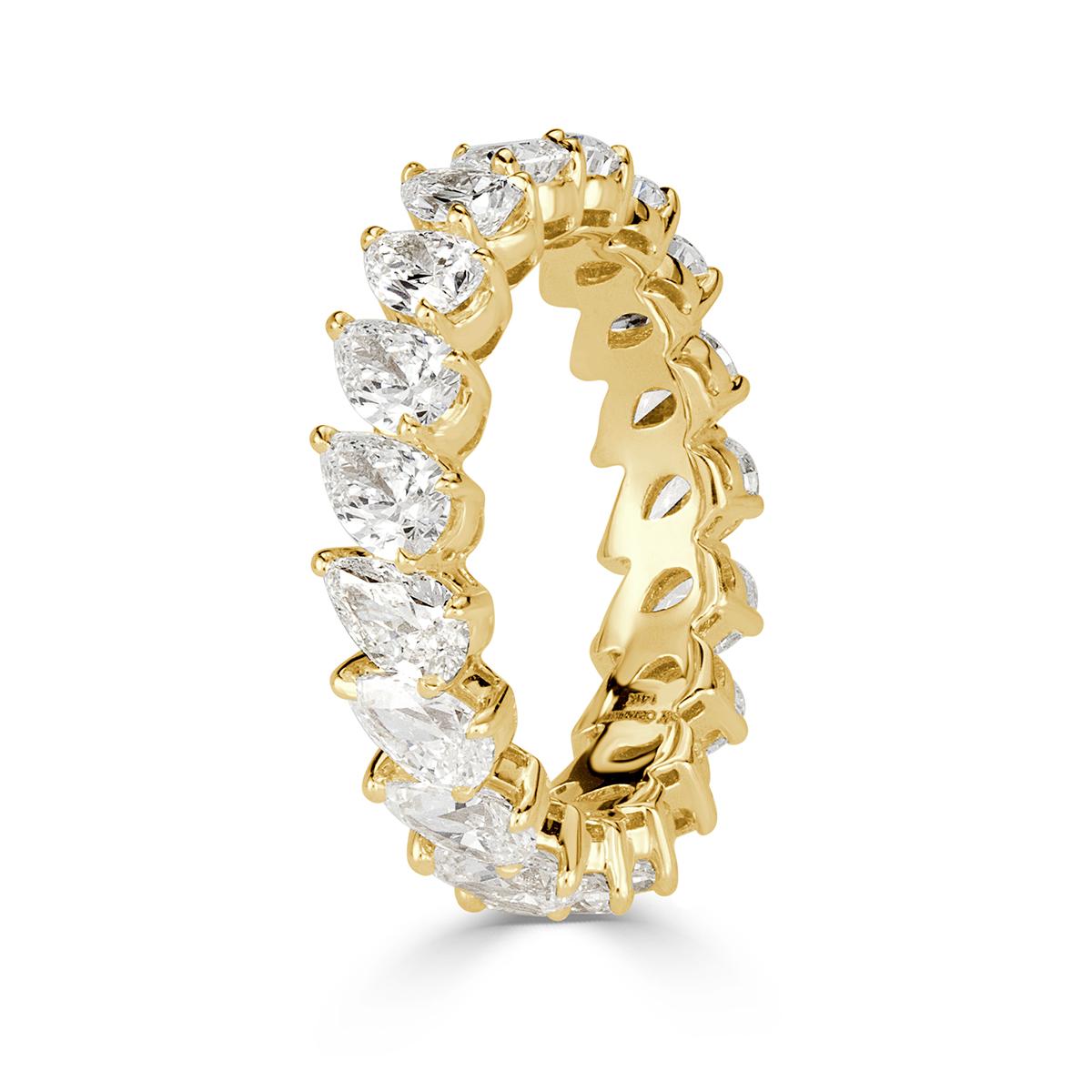 Custom created in 18k yellow gold, this stunning diamond eternity band showcases a 3.65ct of pear shaped diamonds graded at E-F in color, VS1-VS2 in clarity. They are each hand selected and matched with the utmost care. Absolutely stunning from