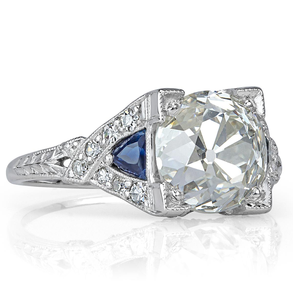 This stunning diamond engagement ring showcases a superb 3.55ct old European cut center diamond, GIA certified at I-SI2. It originates from the Edwardian period, circa 1915 and is beautifully handcrafted in platinum. It is accented by two trillion