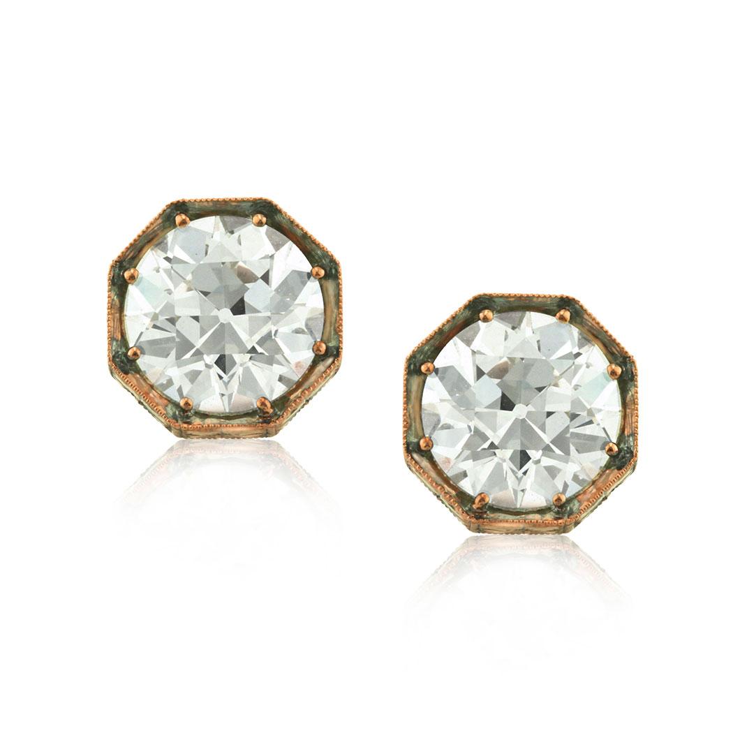 This gorgeous pair of diamond earrings features two beautiful and rare old European cut diamonds weighing respectively 2.03ct and 2.06ct. They are each GIA certified at Q-VS2 and R-VS2 and set in a custom, 18k rose gold setting.