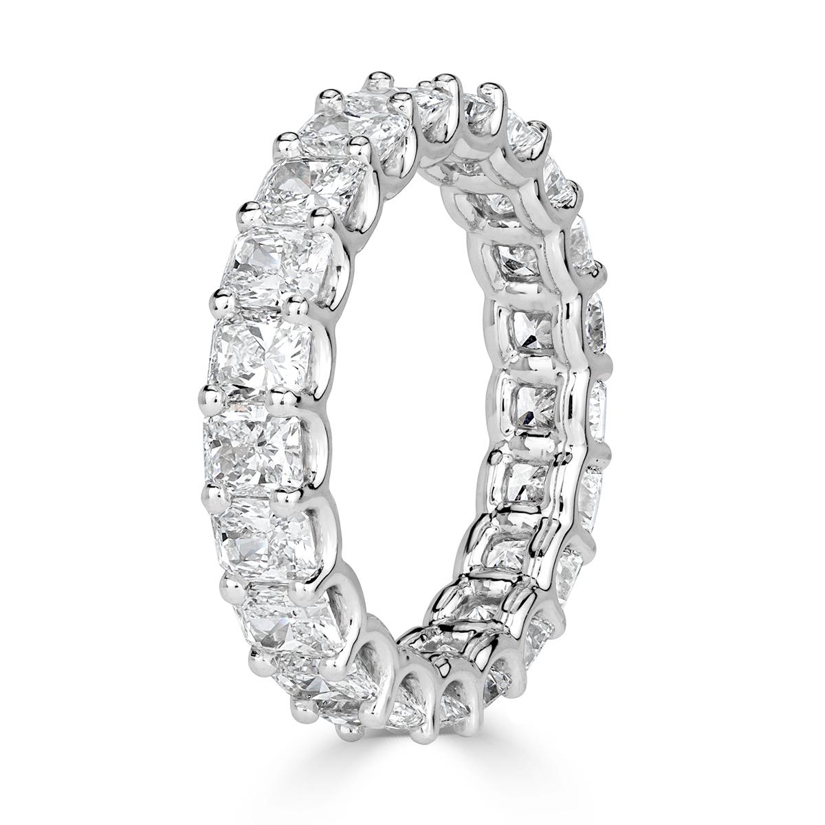 This gorgeous diamond eternity band features 4.14ct of radiant cut diamonds graded at E-F, VS1-VS2. They are set in a custom, 18k white gold 