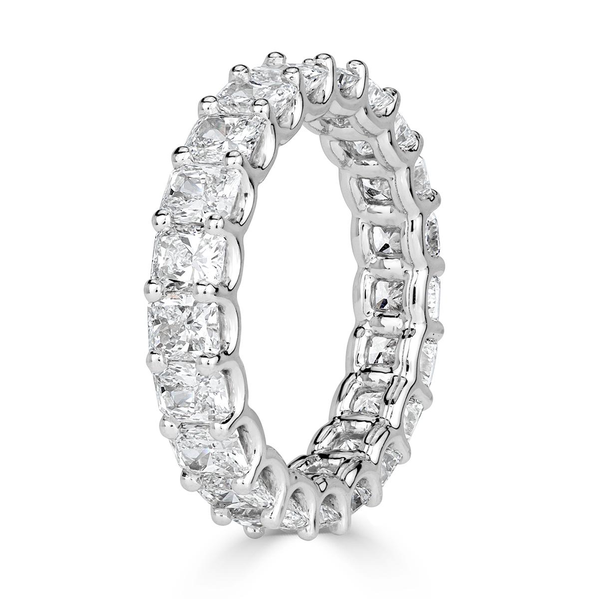This glamorous diamond eternity band showcases 4.14ct of perfectly matched radiant cut diamonds graded at E-F in color, VS1-VS2 in clarity. They are set in a 