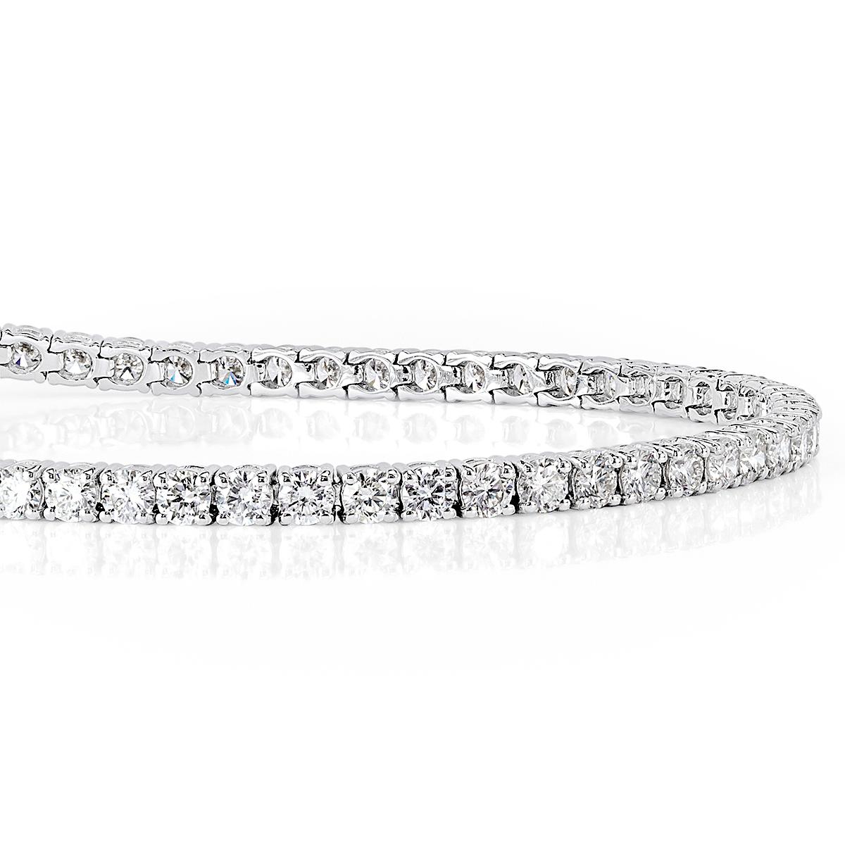 This classic diamond tennis bracelet showcases 4.35ct of round brilliant cut diamonds set in a classic 14k white gold, four prong setting. The diamonds face up peerless white and are absolutely eye clean. It features a double safety clasp for added