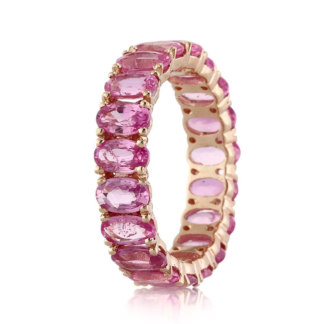 This stunning eternity band features 5.00ct of pink oval cut sapphires hand set to perfection in high polish 14k rose gold. All eternity bands are shown in a size 6.5. We custom craft each eternity band and will create the same design for you in