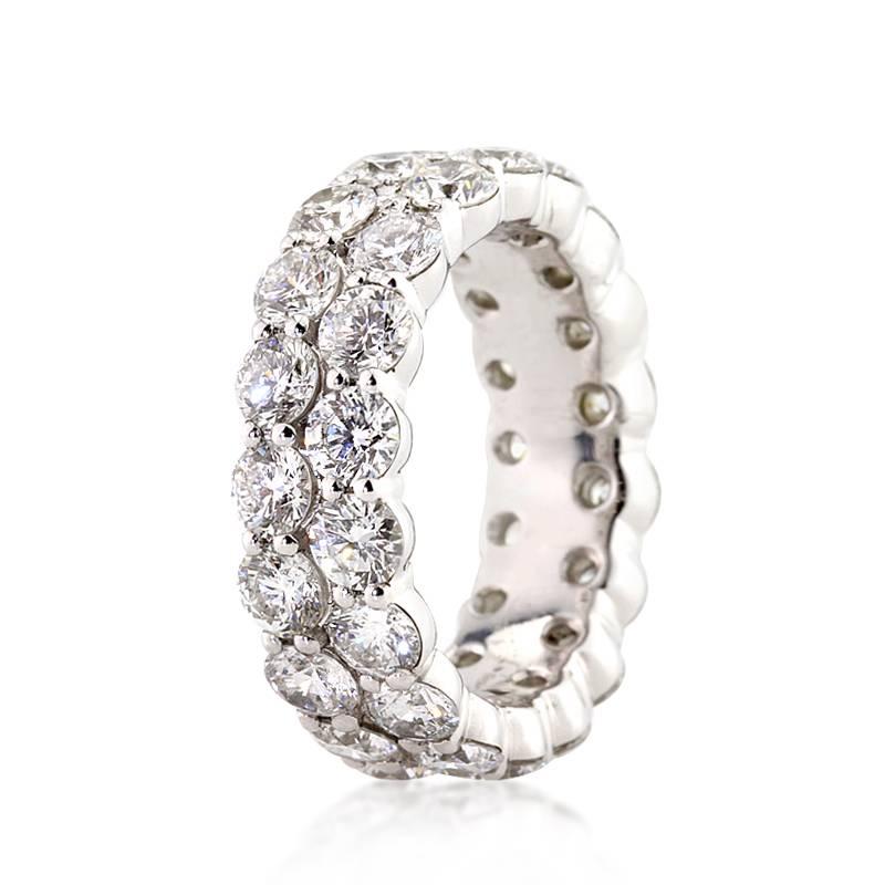 This diamond eternity band showcases 5.03ct of round brilliant cut diamonds graded at G-H, VS1-VS2. All of the diamonds are hand selected and set in 18k white gold. All eternity bands are shown in a size 6.5. We custom craft each eternity band and