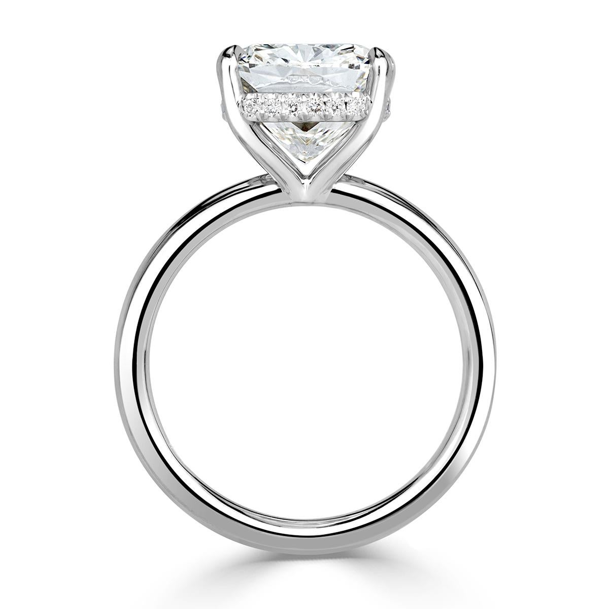 Created in high polish patinum, this one of a kind diamond engagement ring showcases a superb 5.01ct cushion cut center diamond, GIA certified at I-VS1. It measures an exceptional 10.90 x 9.50 mm which allows it to face up more like a 5.50ct+