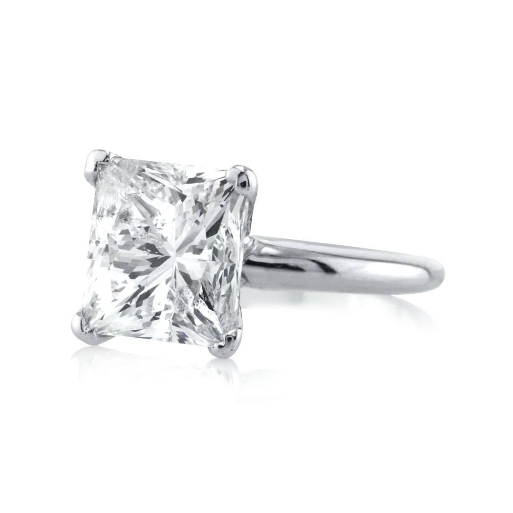 This gorgeous solitaire diamond engagement ring is set with a stunning 5.29ct princess cut diamond, EGL certified at G-H-SI2. It is beautifully set in a dainty four-prong, 14k white gold setting.
