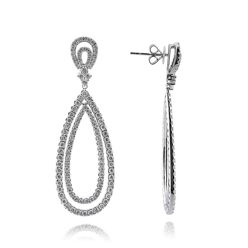 This gorgeous pair of teardrop diamond dangle earrings is set with 5.35ct round brilliant cut diamonds in 18k white gold. The diamonds are graded at E-F, VS1-VS2. 