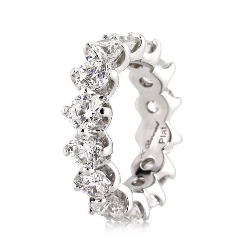 This magnificent diamond eternity band features 5.50ct of round brilliant cut diamonds graded at E-F, VS1-VS2. Exceptionally white and perfectly clear, the premium quality diamonds sparkle in this handcrafted 18k white gold prong setting. All