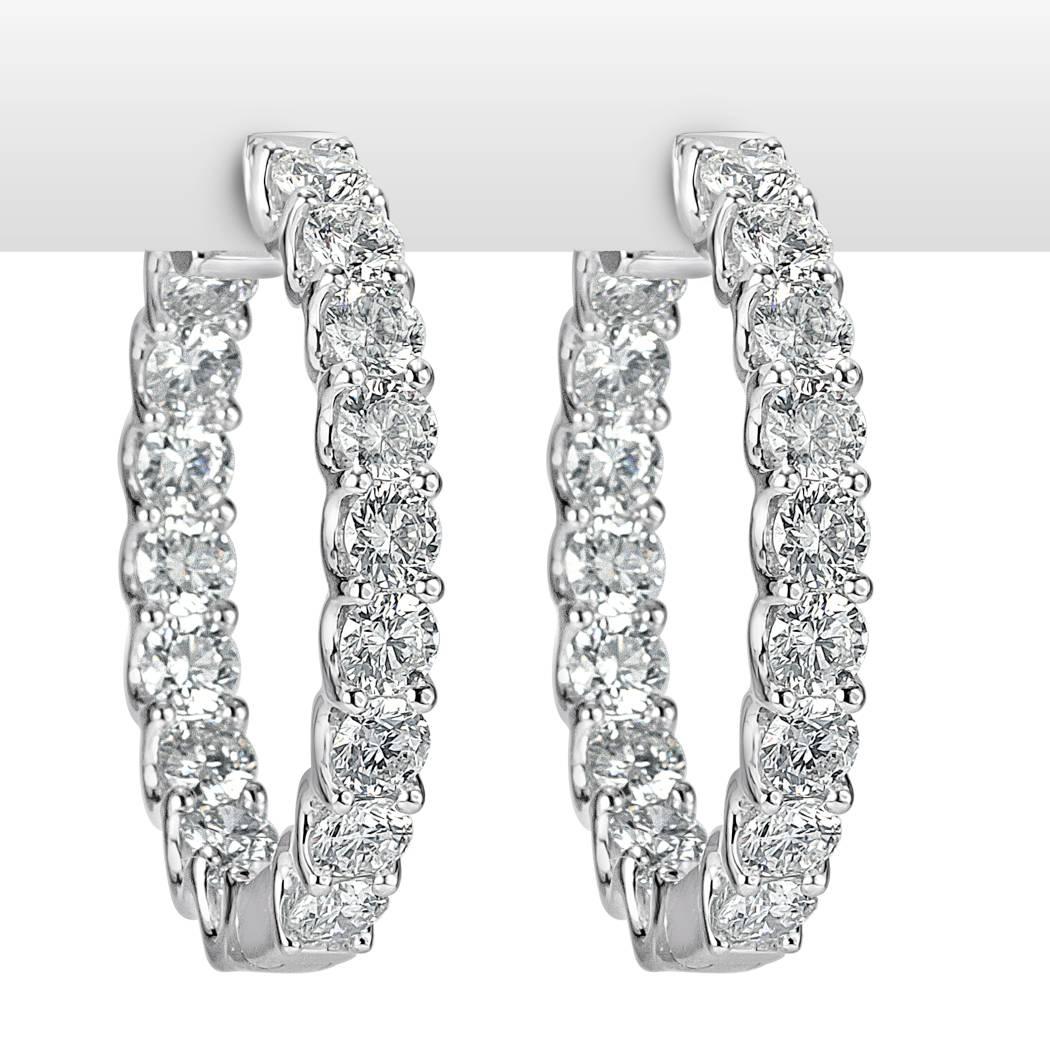 This gorgeous pair of diamond hoop earrings is set with a whopping 7.00ct of round brilliant cut diamonds set in a 14k white gold, 