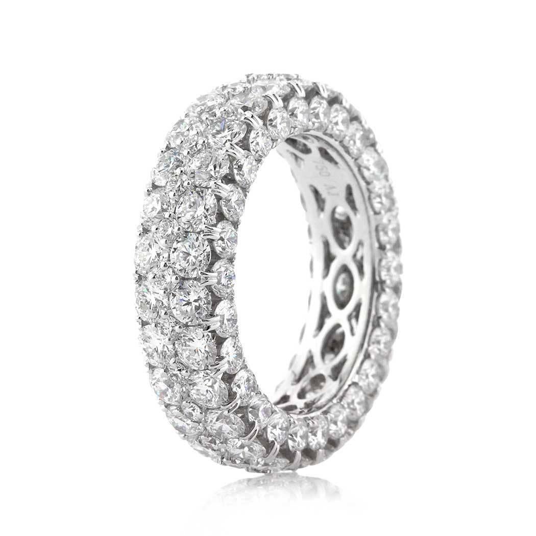 This three-sided diamond eternity band is set with 7.00ct of round brilliant cut diamonds. They are graded at E-F, VS1-VS2 and set to perfection in 18k white gold. All eternity bands are shown in a size 6.5. We custom craft each eternity band and