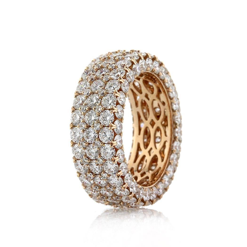 This stunning diamond eternity ring showcases 7.35ct of round brilliant cut diamonds micro pave set in 18k rose gold. The diamonds are graded at E-F in color, VS1-VS2 in clarity. Three rows of diamonds are displayed on the front and each of the