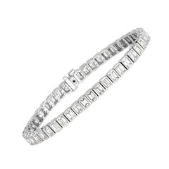 Mark Broumand Bracelet tennis en or 18 carats avec diamants taille émeraude de 8,80 carats sertis sur le chaton